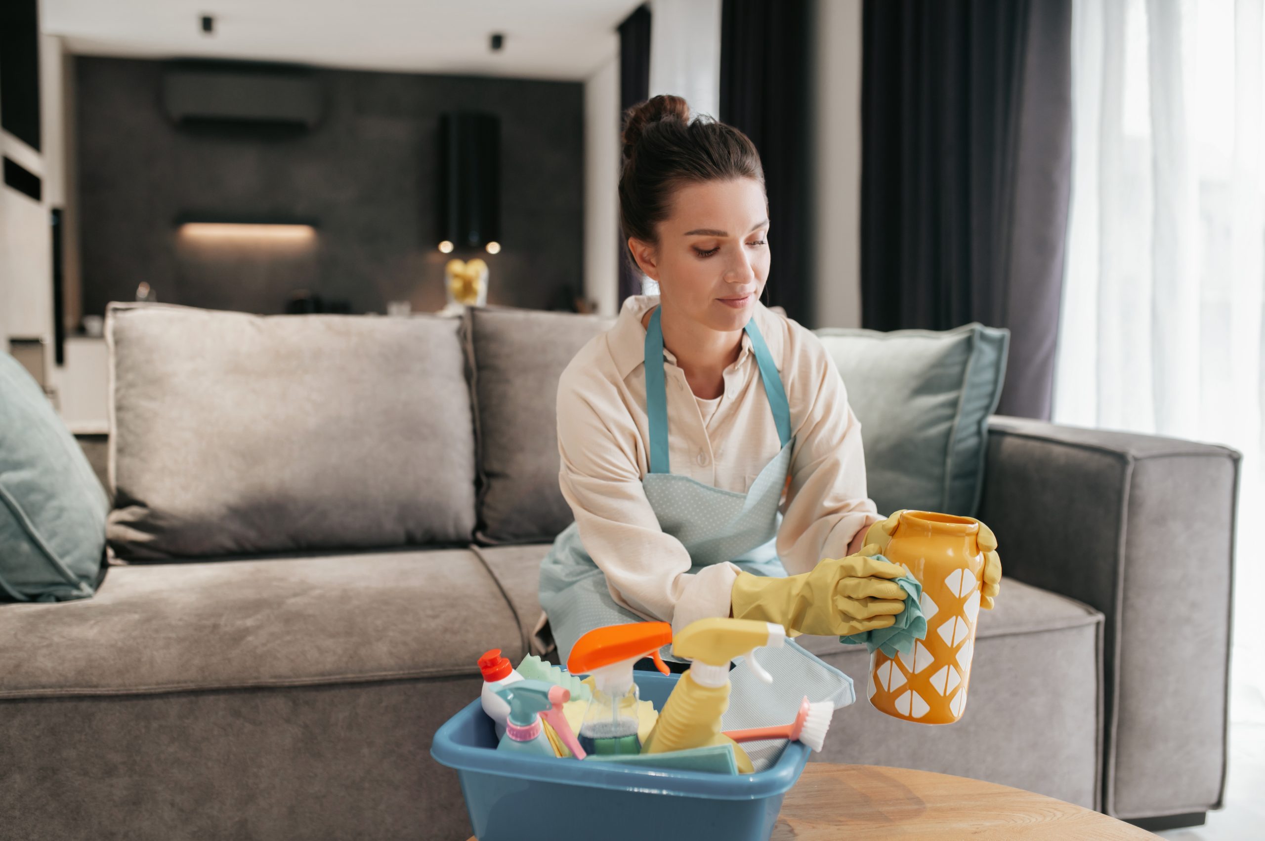 Young woman doing housework and looking busy Busy day. Young woman doing housework and looking busy